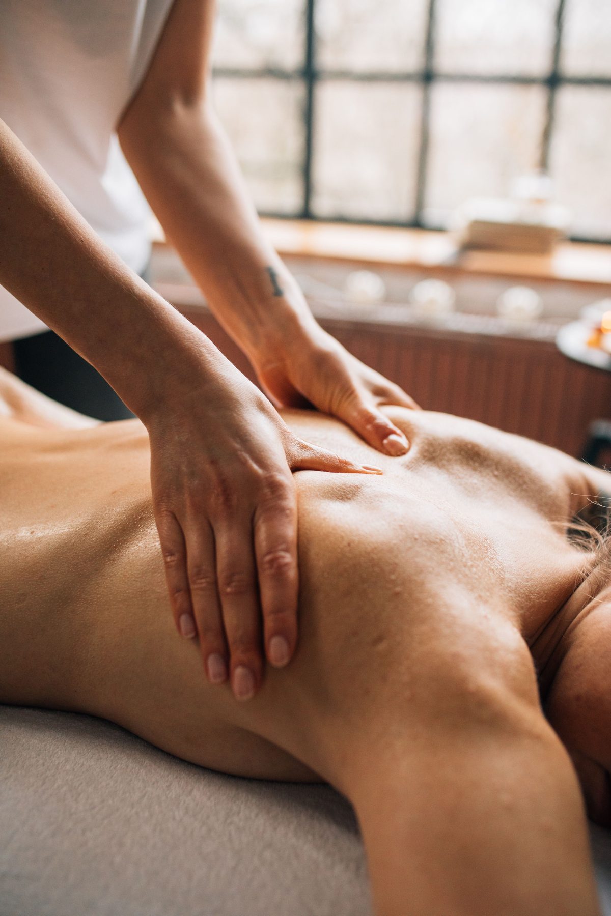 Deep tissue massage room with adjustable table at spa in Mahipalpur, New Delhi